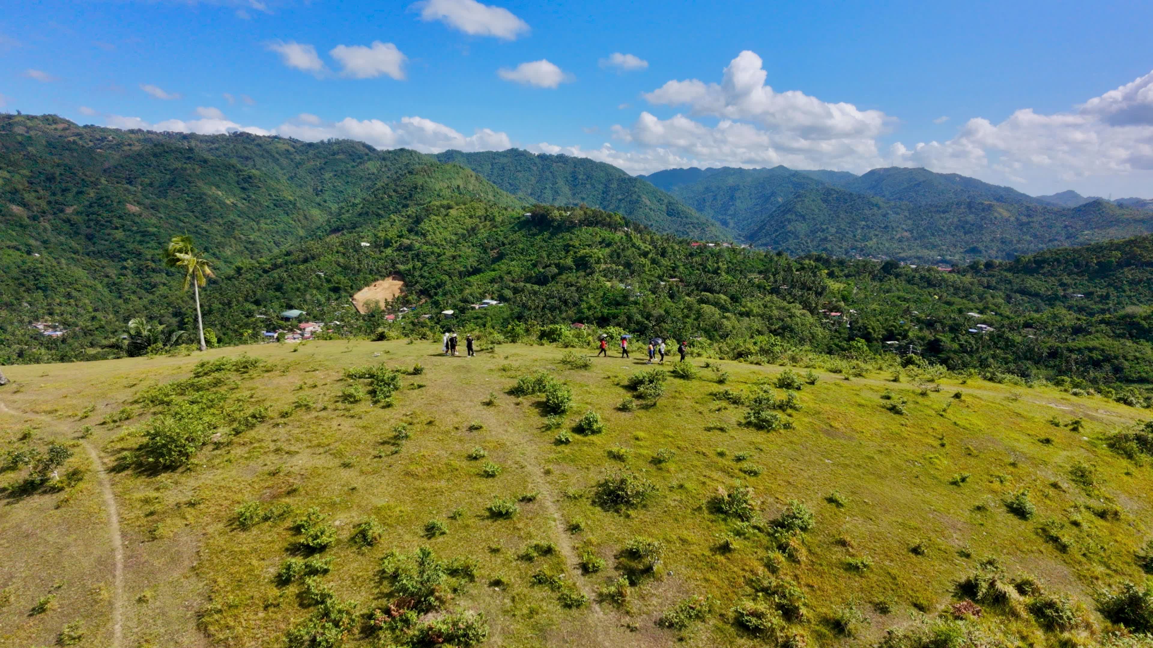 Cebu mountain ridge at sunrise with hikers on trail